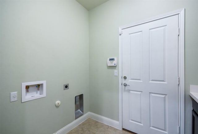 111 Bear Creek Ln, Georgetown, TX 78633 - washroom featuring hookup for an electric dryer, washer hookup, baseboards, hookup for a gas dryer, and light tile patterned flooring