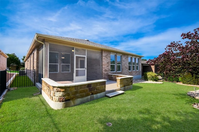 111 Bear Creek Ln, Georgetown, TX 78633 - back of house with a sunroom and brick siding
