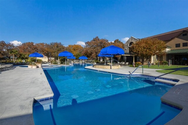 111 Bear Creek Ln, Georgetown, TX 78633 - community pool featuring a patio