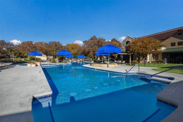 111 Bear Creek Ln, Georgetown, TX 78633 - community pool featuring a patio area