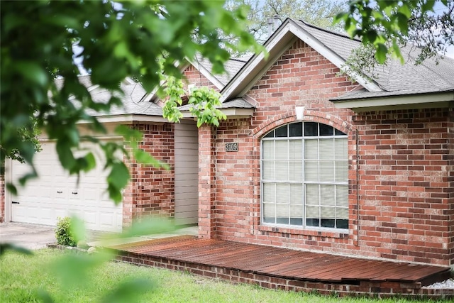 exterior view of brick siding and roof with shingles