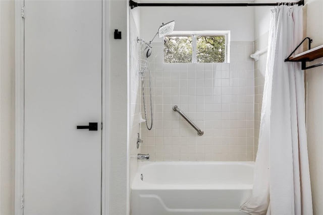 bathroom featuring shower / bathtub combination with curtain