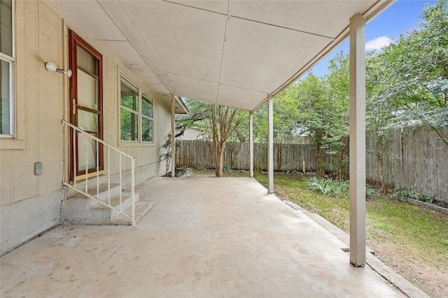 view of patio featuring entry steps and a fenced backyard