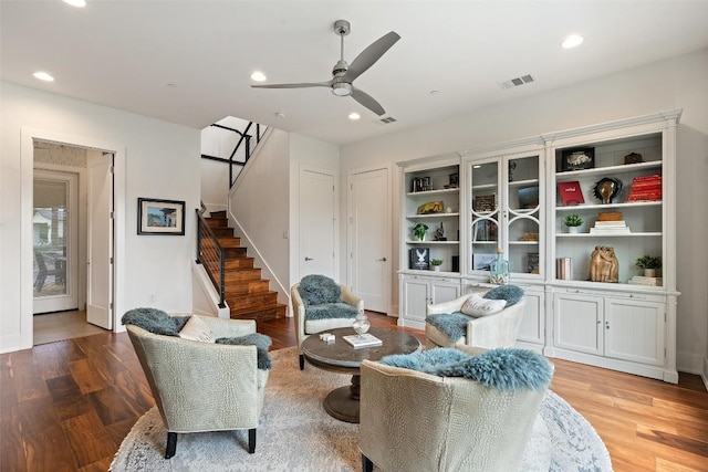 908 Cypress Grove Dr, Austin, TX 78732 - sitting room featuring stairway, a ceiling fan, recessed lighting, and wood finished floors