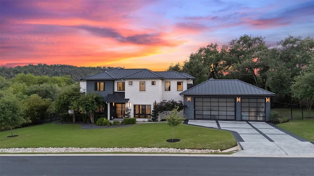 908 Cypress Grove Dr, Austin, TX 78732 - modern inspired farmhouse featuring a standing seam roof, a metal roof, stucco siding, a lawn, and concrete driveway