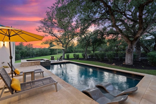 view of swimming pool featuring a patio and a pool with connected hot tub