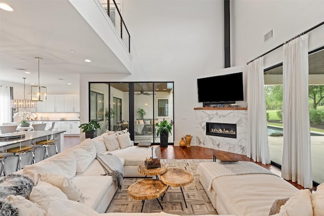 908 Cypress Grove Dr, Austin, TX 78732 - living room with a towering ceiling, a fireplace, and a ceiling fan