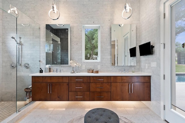 908 Cypress Grove Dr, Austin, TX 78732 - bathroom featuring double vanity, a shower stall, and tile walls