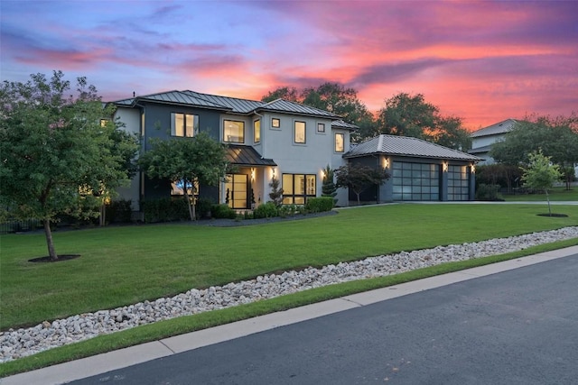 908 Cypress Grove Dr, Austin, TX 78732 - view of front facade with a standing seam roof, a metal roof, stucco siding, and a yard