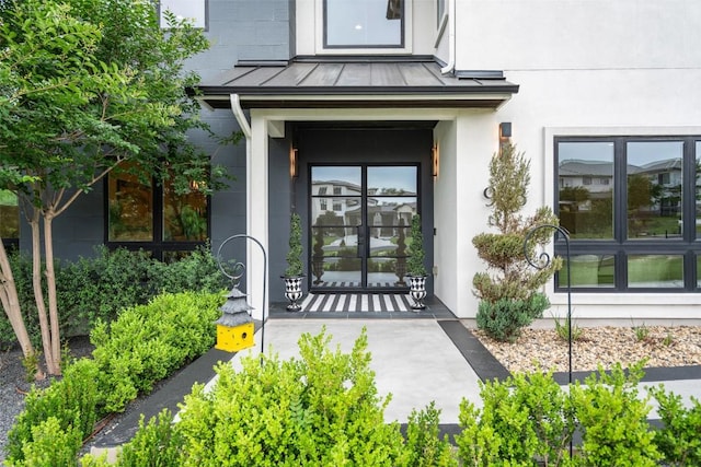 908 Cypress Grove Dr, Austin, TX 78732 - entrance to property featuring a standing seam roof, french doors, and a metal roof