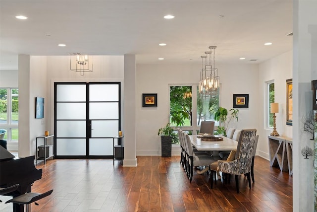 dining area with a chandelier, dark wood-style floors, baseboards, and recessed lighting