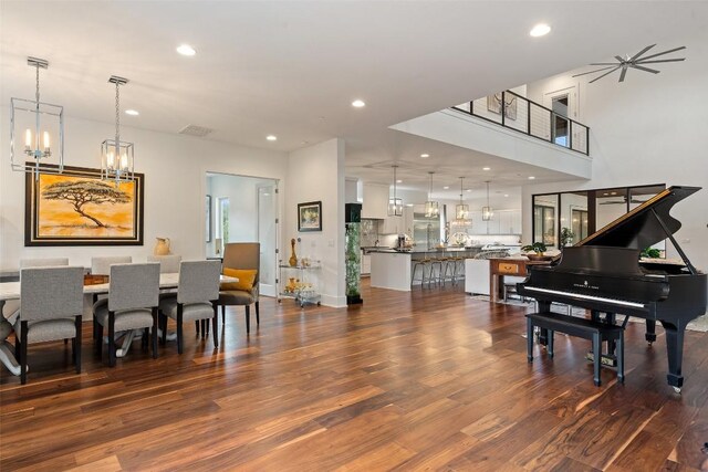 908 Cypress Grove Dr, Austin, TX 78732 - dining space featuring a chandelier, dark wood-style floors, and recessed lighting