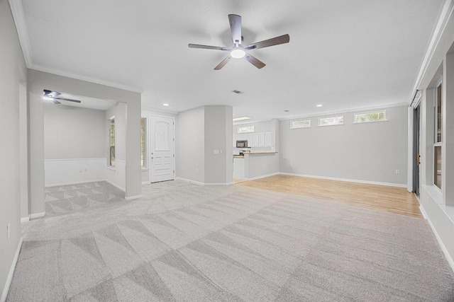 258 Whispering Wind Dr, Georgetown, TX 78633 - unfurnished living room featuring crown molding, a ceiling fan, light carpet, recessed lighting, and baseboards