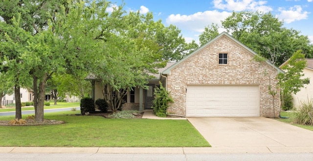 258 Whispering Wind Dr, Georgetown, TX 78633 - obstructed view of property with driveway, a front lawn, and brick siding