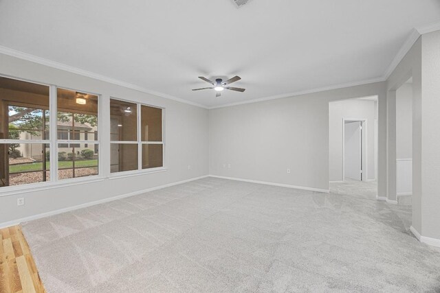 258 Whispering Wind Dr, Georgetown, TX 78633 - spare room with ornamental molding, ceiling fan, and carpet