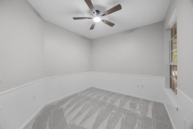 258 Whispering Wind Dr, Georgetown, TX 78633 - unfurnished room with a ceiling fan, wainscoting, and carpet