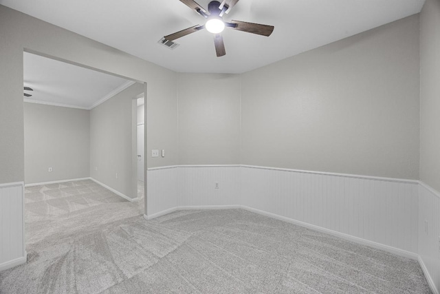 258 Whispering Wind Dr, Georgetown, TX 78633 - carpeted spare room with ceiling fan and a wainscoted wall