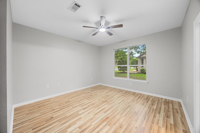 258 Whispering Wind Dr, Georgetown, TX 78633 - empty room featuring light wood finished floors, a ceiling fan, and baseboards