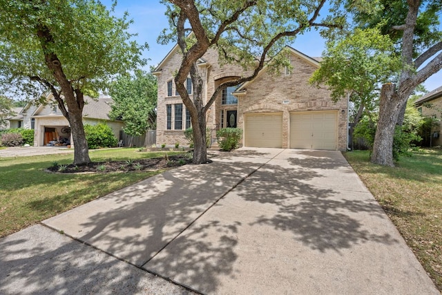 9013 Lantana Way, Austin, TX 78749 - traditional home with driveway, a front lawn, and brick siding