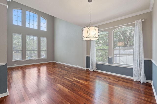 9013 Lantana Way, Austin, TX 78749 - unfurnished dining area with wood-type flooring and baseboards