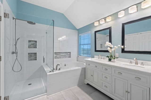 9013 Lantana Way, Austin, TX 78749 - bathroom with a stall shower, a bath, vaulted ceiling, double vanity, and tile patterned flooring