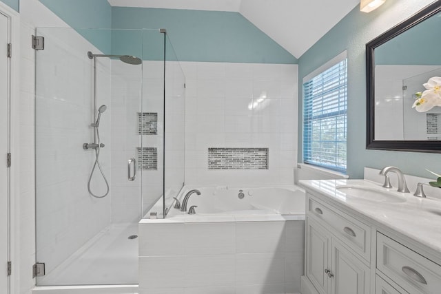 9013 Lantana Way, Austin, TX 78749 - bathroom featuring a bath, a shower stall, vanity, and vaulted ceiling