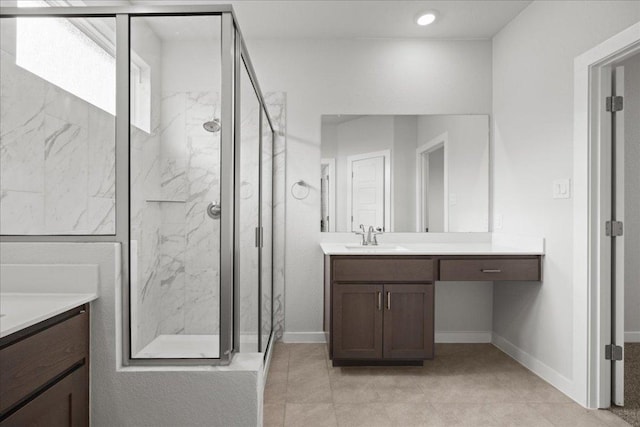 115 Paul Pena Dr, San Marcos, TX 78666 - bathroom with vanity, a marble finish shower, baseboards, and tile patterned floors