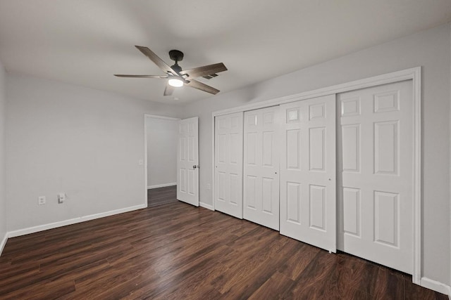 7516 Marble Crest Dr, Austin, TX 78747 - unfurnished bedroom featuring baseboards, dark wood-style floors, a closet, and ceiling fan