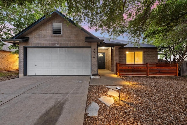 7516 Marble Crest Dr, Austin, TX 78747 - ranch-style house with brick siding, driveway, a garage, and fence