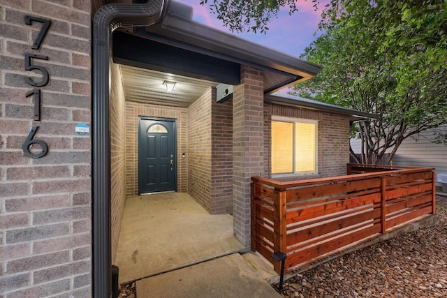 7516 Marble Crest Dr, Austin, TX 78747 - doorway to property featuring brick siding
