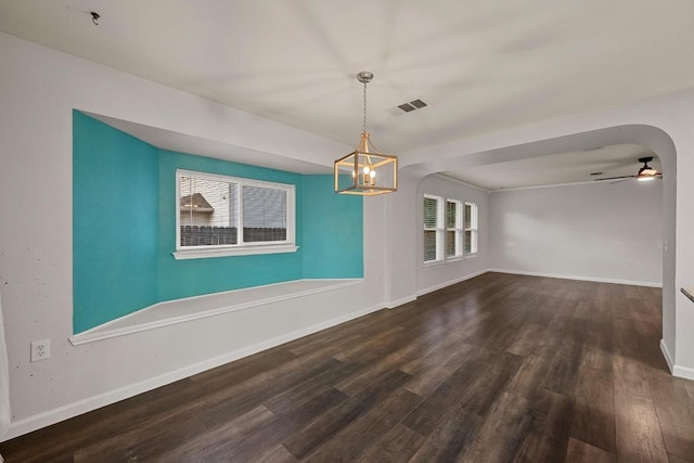 7516 Marble Crest Dr, Austin, TX 78747 - unfurnished dining area featuring wood finished floors, ceiling fan, baseboards, and a chandelier