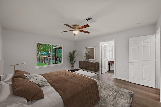 7516 Marble Crest Dr, Austin, TX 78747 - bedroom featuring wood finished floors, baseboards, ceiling fan, and ensuite bath