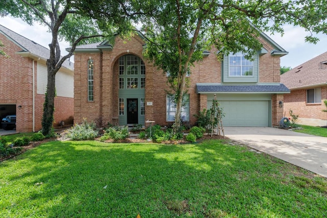 2113 Spring Hollow Path, Round Rock, TX 78681 - traditional-style home with driveway, brick siding, a garage, and a front yard