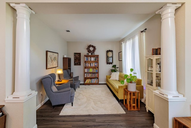 2113 Spring Hollow Path, Round Rock, TX 78681 - living area featuring decorative columns, dark wood-type flooring, and baseboards