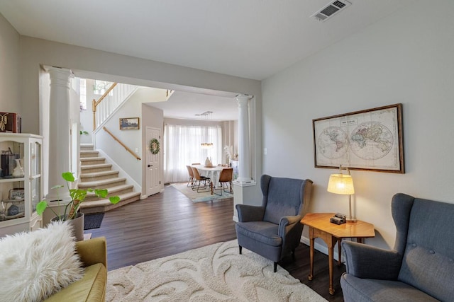 2113 Spring Hollow Path, Round Rock, TX 78681 - living area featuring decorative columns, wood finished floors, stairs, and baseboards