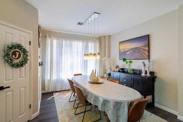 2113 Spring Hollow Path, Round Rock, TX 78681 - dining room with baseboards and dark wood-style flooring