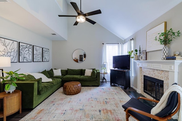 2113 Spring Hollow Path, Round Rock, TX 78681 - living area featuring a ceiling fan, high vaulted ceiling, wood finished floors, and a glass covered fireplace