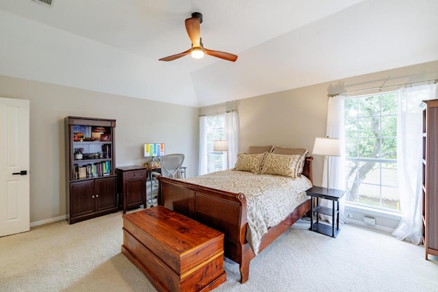 2113 Spring Hollow Path, Round Rock, TX 78681 - bedroom featuring light colored carpet, multiple windows, baseboards, and lofted ceiling