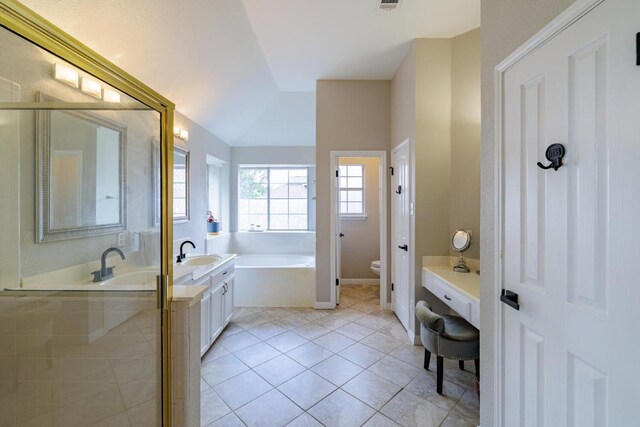 2113 Spring Hollow Path, Round Rock, TX 78681 - full bathroom featuring toilet, double vanity, a garden tub, and tile patterned floors