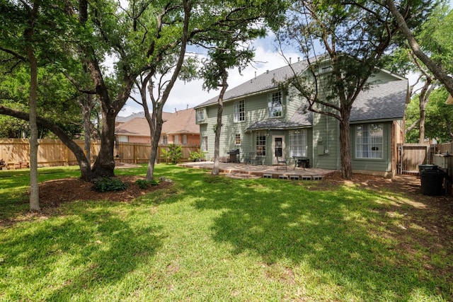 2113 Spring Hollow Path, Round Rock, TX 78681 - back of property featuring roof with shingles and a patio area