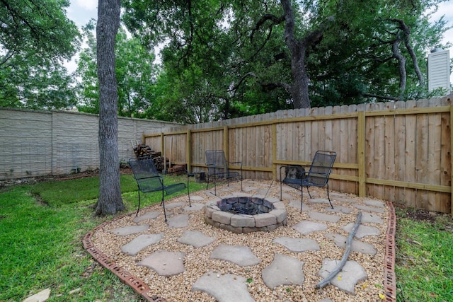 2113 Spring Hollow Path, Round Rock, TX 78681 - view of patio featuring an outdoor fire pit and a fenced backyard