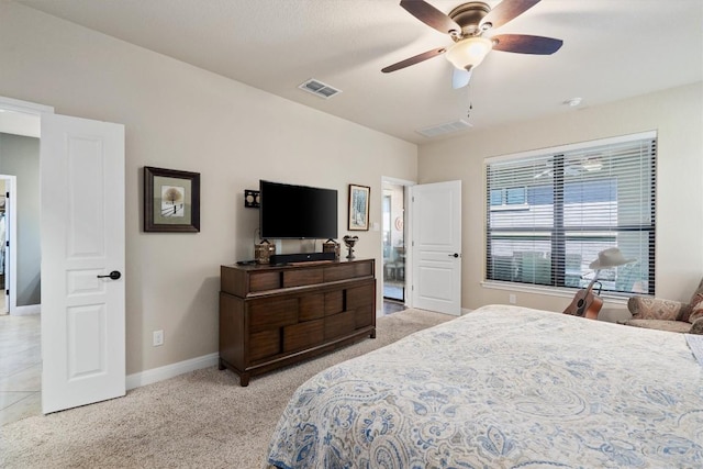 4332 Teravista Club Dr Unit 69, Round Rock, TX 78665 - bedroom featuring light colored carpet, baseboards, and a ceiling fan
