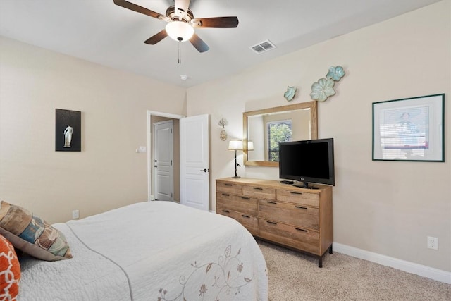 4332 Teravista Club Dr Unit 69, Round Rock, TX 78665 - bedroom with baseboards, light carpet, and a ceiling fan