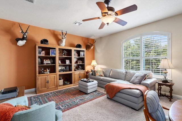 4332 Teravista Club Dr Unit 69, Round Rock, TX 78665 - living room with carpet flooring, ceiling fan, and baseboards