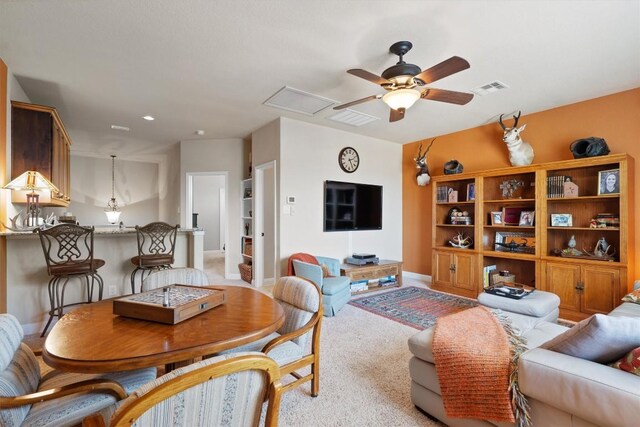 4332 Teravista Club Dr Unit 69, Round Rock, TX 78665 - living area featuring ceiling fan, baseboards, and light carpet