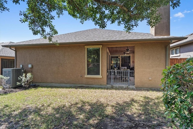 4332 Teravista Club Dr Unit 69, Round Rock, TX 78665 - rear view of house featuring cooling unit, ceiling fan, stucco siding, a chimney, and a shingled roof