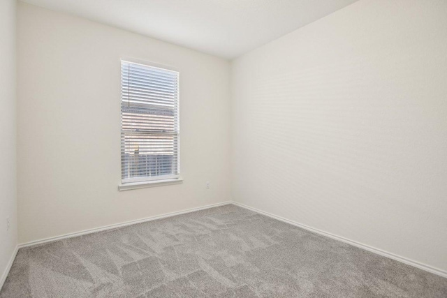 212 Mauldin St, Georgetown, TX 78628 - empty room with carpet flooring and baseboards