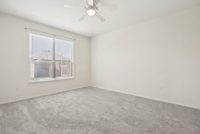 212 Mauldin St, Georgetown, TX 78628 - carpeted spare room featuring ceiling fan and baseboards