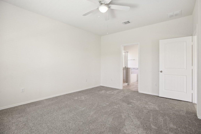 212 Mauldin St, Georgetown, TX 78628 - unfurnished bedroom featuring carpet, baseboards, ensuite bathroom, and a ceiling fan