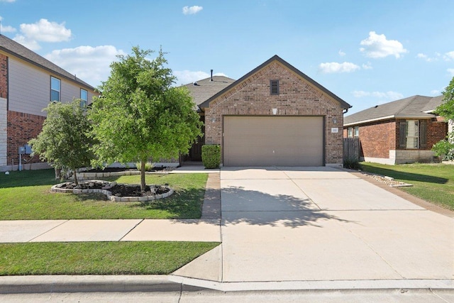 212 Mauldin St, Georgetown, TX 78628 - view of front of property featuring brick siding, a front yard, driveway, and an attached garage